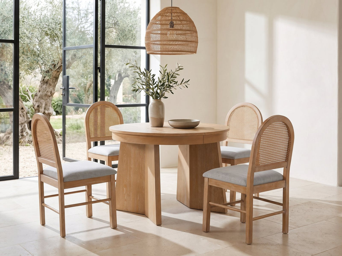 Siderno 42-Inch Extending Round Dining Set with 4 Chairs in a sunlit villa dining area with olive trees outside
