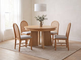 Siderno 42-Inch Extending Round Dining Set with 4 Chairs in a calm Scandinavian dining room on a wool rug