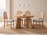 Siderno 42-Inch Extending Round Dining Set with 4 Chairs in a bright coastal dining room on a jute rug