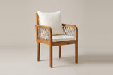 One Siracusa armchair from the front three-quarter view: rope sides and back, rounded arm fronts, ivory seat and back cushions