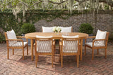 Siracusa acacia oval dining set with six rope armchairs in a Savannah courtyard garden, an old grey brick wall with creeping fig and a herringbone brick floor (tableware not included)