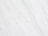 Close-up of the Soleto White Marble Ring-Base Side Table: the white marble of the top