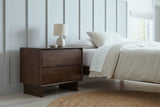 Sorso warm brown nightstand against dove grey board-and-batten panelling in a Minneapolis bedroom with a round jute rug