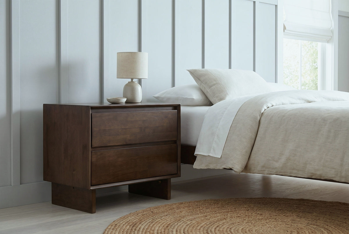 Sorso warm brown nightstand against dove grey board-and-batten panelling in a Minneapolis bedroom with a round jute rug