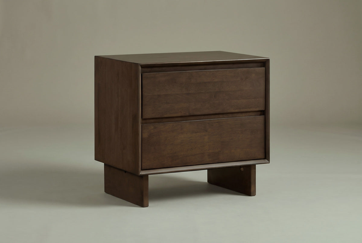 The Sorso two-drawer nightstand in warm brown solid wood, three-quarter view on a light studio backdrop
