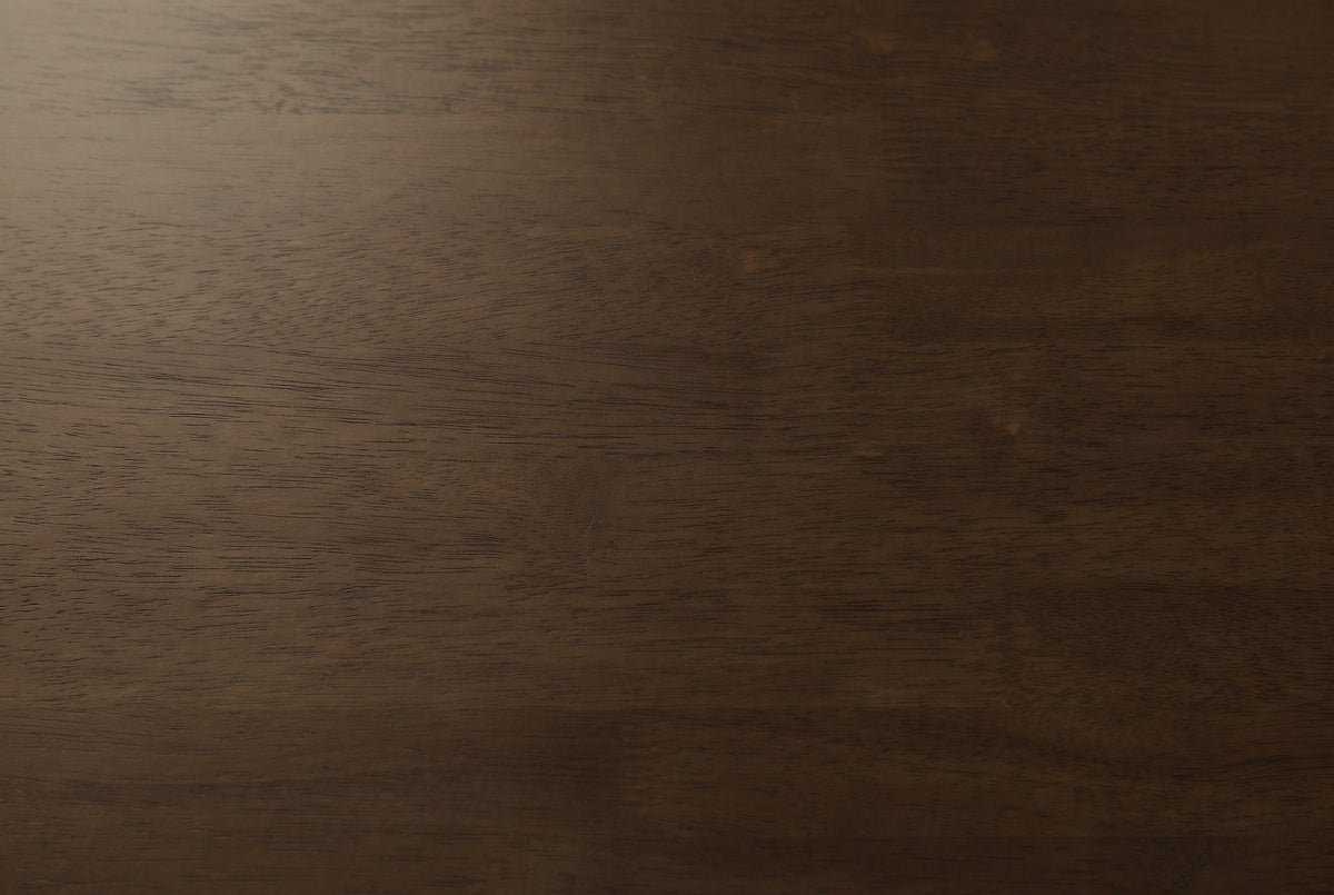 Close-up of the warm brown solid wood on the Sorso nightstand: fine grain and the joints between the wood staves