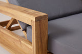 Close-up of the solid acacia on the Sortino chaise: the square post and top rail of a box arm in a light natural finish