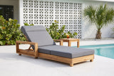 Sortino acacia chaise on a terrazzo pool deck at a Sarasota mid-century house, a white breeze-block wall and a sabal palm behind (side table not included)