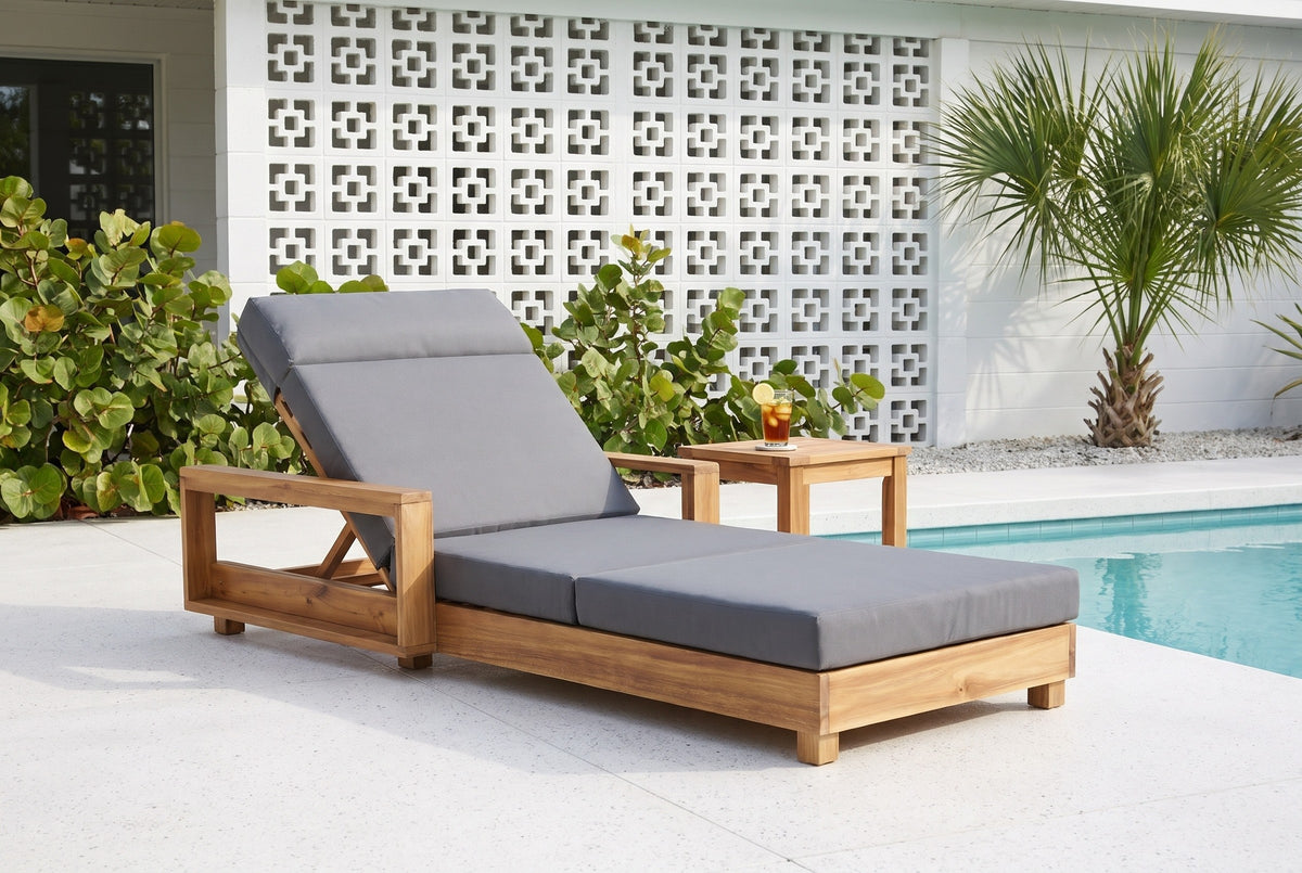Sortino acacia chaise on a terrazzo pool deck at a Sarasota mid-century house, a white breeze-block wall and a sabal palm behind (side table not included)