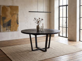 Soveria 63-Inch Round Black Acacia Sunburst Dining Table in an industrial loft dining area