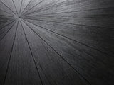 Close-up of the Soveria 63-Inch Round Black Acacia Sunburst Dining Table: the black wire-brushed acacia sunburst top