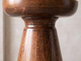 Close-up of the Specchia Brown Mango Cone Pedestal Side Table: the rounded cap over the turned neck and cone