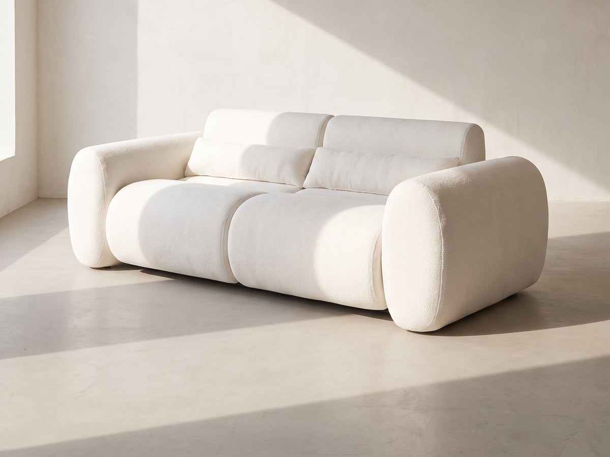 Spello Cloud Sofa in white against a plaster wall in morning light