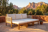 Sperlinga sofa pulled out into a daybed on a Sedona flagstone terrace with a red sandstone wall and red rock buttes behind (planter not included)