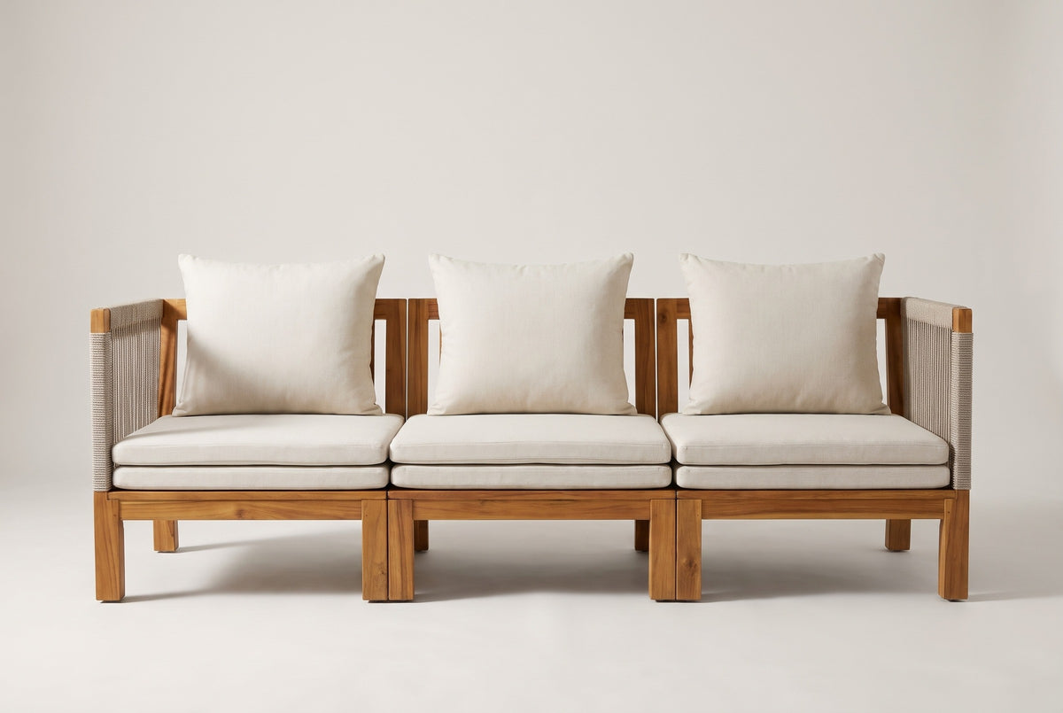 The Sperlinga sofa seen straight from the front: three sections, stacked seat pads, three back cushions and rope arms at both ends