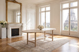 Squillace 85-Inch Oval Reclaimed Pine Dining Table in a Paris salon