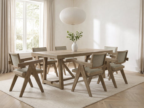 Stilo 84-Inch Weathered Oak Trestle Dining Set with 6 Armchairs in a bright plaster dining room with linen curtains