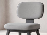 Close-up of the Strongoli 80-Inch Oval Fluted Pedestal Dining Set with 4 Chairs: the floating light grey back cushion on its charcoal wood spine above the padded seat