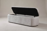 The Subiaco bench with the lid open on metal supports: a black-fabric underside and an empty compartment lined in gray fabric