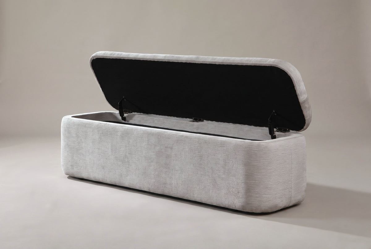 The Subiaco bench with the lid open on metal supports: a black-fabric underside and an empty compartment lined in gray fabric