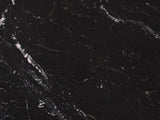 Close-up of the Taormina Black Marble Drum Coffee Table: the white and gold veins of the black marble top