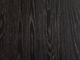 Close-up of the Taranto Black Faceted Drum Coffee Table: the open-pore black wood grain of the octagonal top