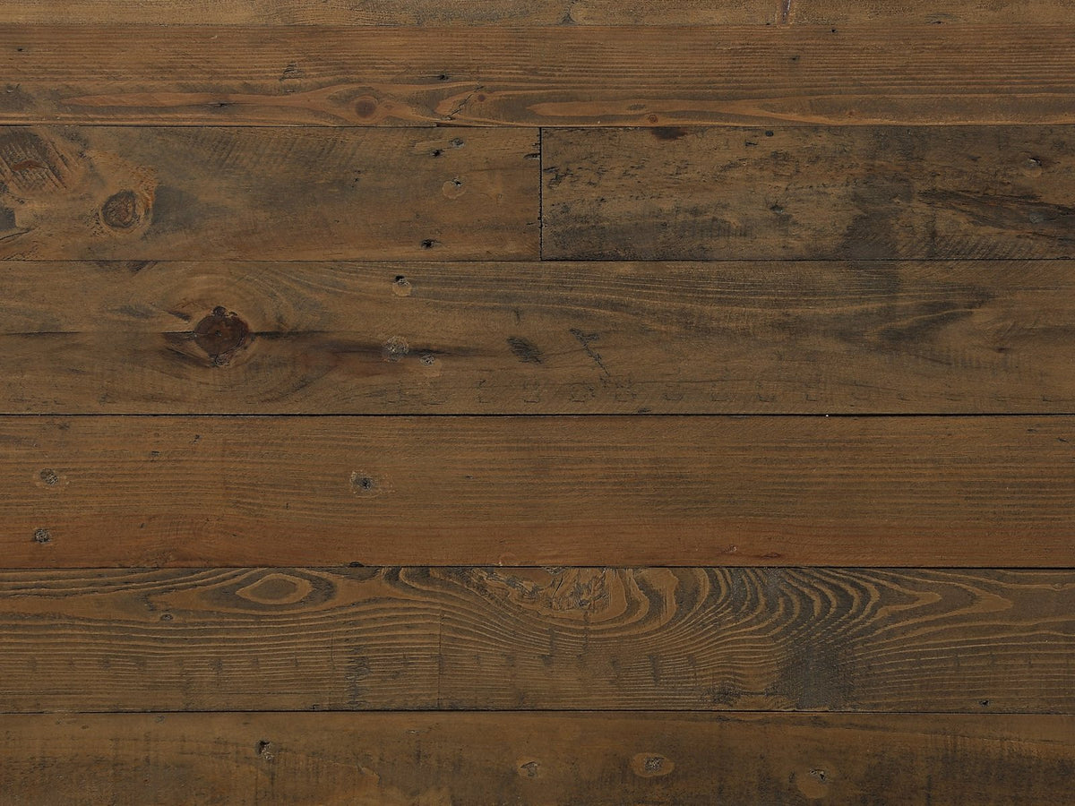 Close-up of the Tarvisio 37-Inch Rustic Caramel 5-Drawer Chest: rough-sawn pine boards with knots, saw marks and nail holes