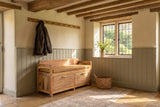 Taurianova 39.5-Inch 2-Drawer Solid Mango Storage Bench with Leather Cushion in an English country dining room