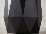 Close-up of the Teglio Black Acacia Faceted Octagon Side Table: the long triangular facets meeting the low ridge above the bevelled foot