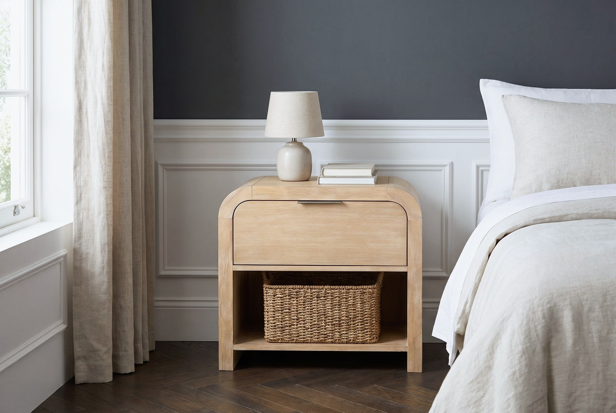 Tempio mango waterfall nightstand with a ceramic lamp against white wainscot panelling and a charcoal wall in a Boston bedroom
