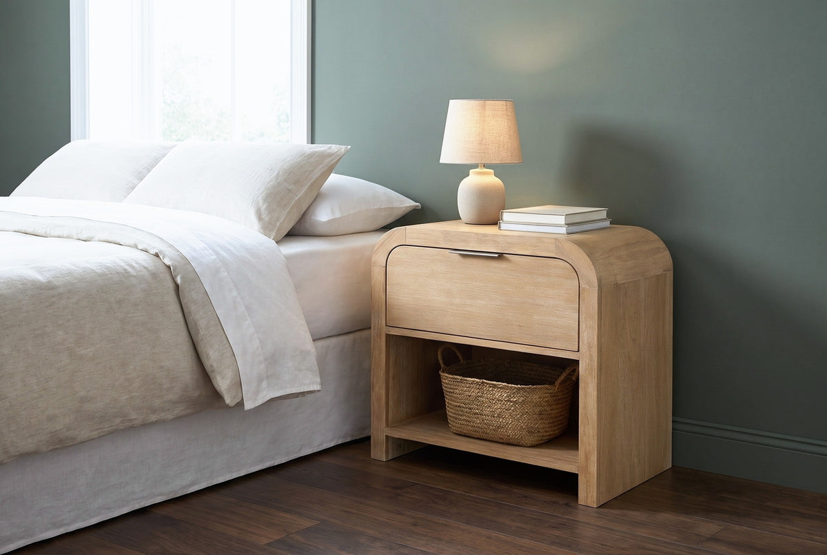 Tempio mango waterfall nightstand against a deep sage green wall in a Portland bedroom with a dark walnut plank floor