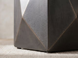 Close-up of the Terlizzi Graphite Cast Aluminum Faceted Side Table: the folded facets meeting at a lower corner above a round foot