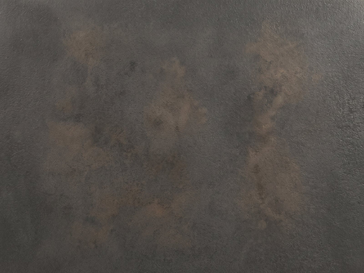 Close-up of the Terlizzi Graphite Cast Aluminum Faceted Side Table: the cast graphite texture of the square top