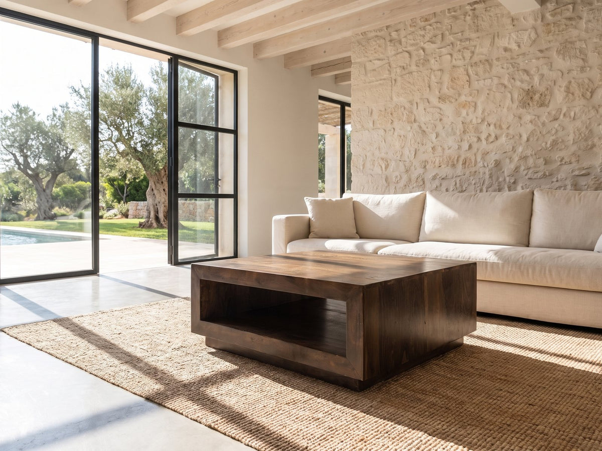 Terracina Solid Mango Block Coffee Table on a jute rug in front of a linen sofa in a poolside villa