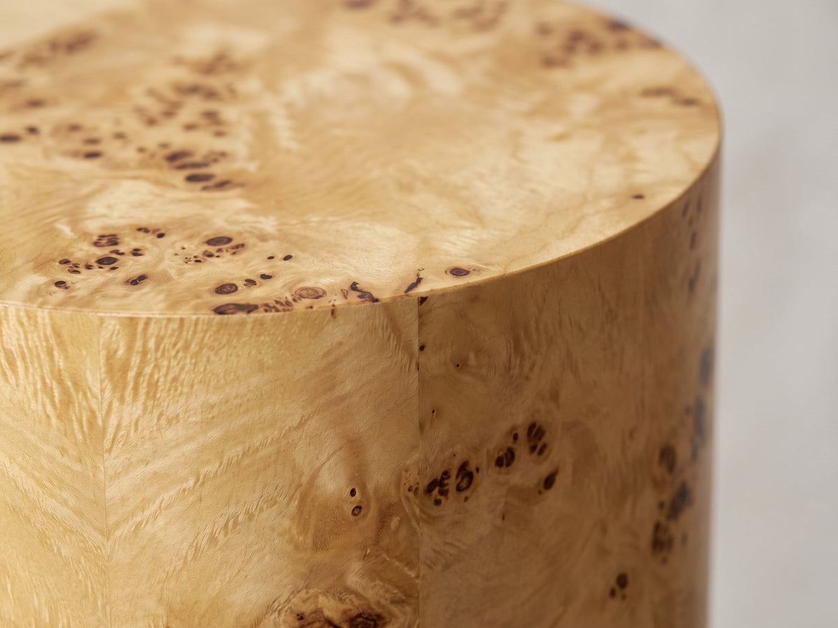Close-up of the Tiriolo Natural Burl Pillar Side Table: the crisp top edge of the burl drum
