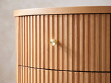 Close-up of the Tolfa Fluted Beech Half-Moon Side Table: the curved reeded drawer front with its brass knob