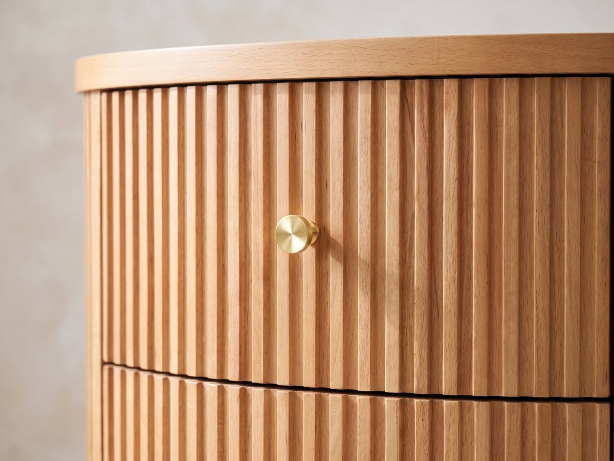 Close-up of the Tolfa Fluted Beech Half-Moon Side Table: the curved reeded drawer front with its brass knob