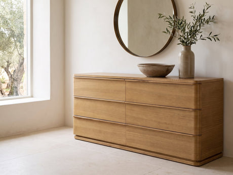 Tolmezzo 72-Inch Natural Oak 6-Drawer Dresser under a round bronze mirror in a villa bedroom