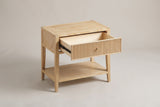 The Tonara nightstand with its one drawer pulled halfway open on metal glides, above the open lower shelf