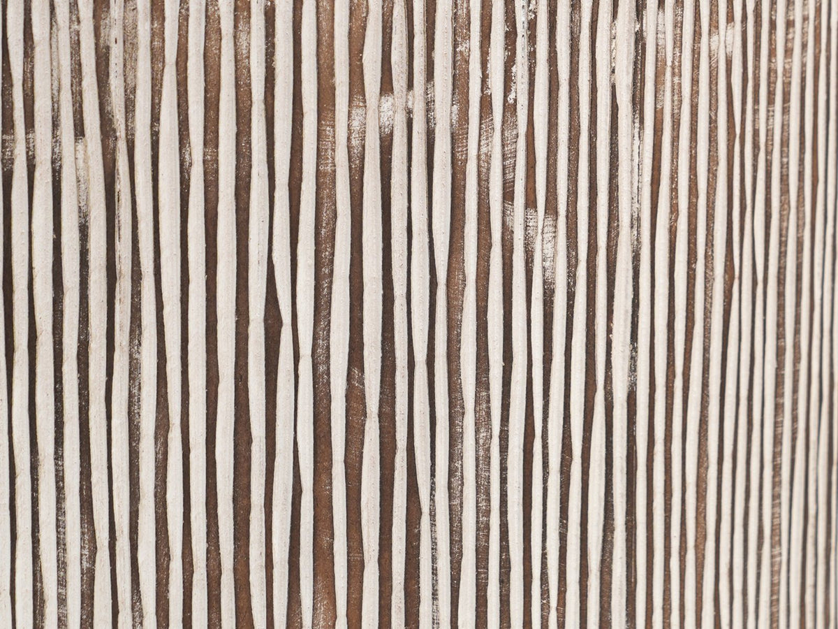 Close-up of the Tortora Carved Whitewash Drum Side Table: the hand-carved grooves of the whitewashed side