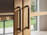 Close-up of the Tremezzo Washed Oak Media Console: two framed glass doors meeting at the centre with slim dark bronze bar handles