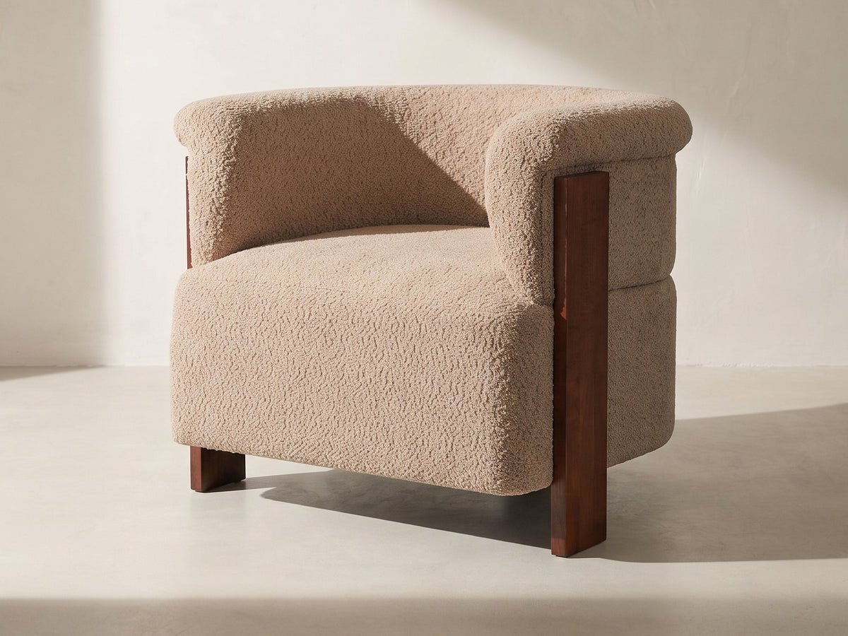 Trevi Wood Plank Barrel Chair in taupe against a plaster wall in morning light