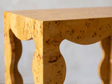 Close-up of the Tricarico Burl Veneer Scalloped Side Table: the scalloped apron and a wavy burl veneer leg