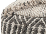 Close-up of the Triora Handloom Wool and Cotton Square Pouf: the heathered wool and cotton weave, the raised loop line and the charcoal band at a top corner