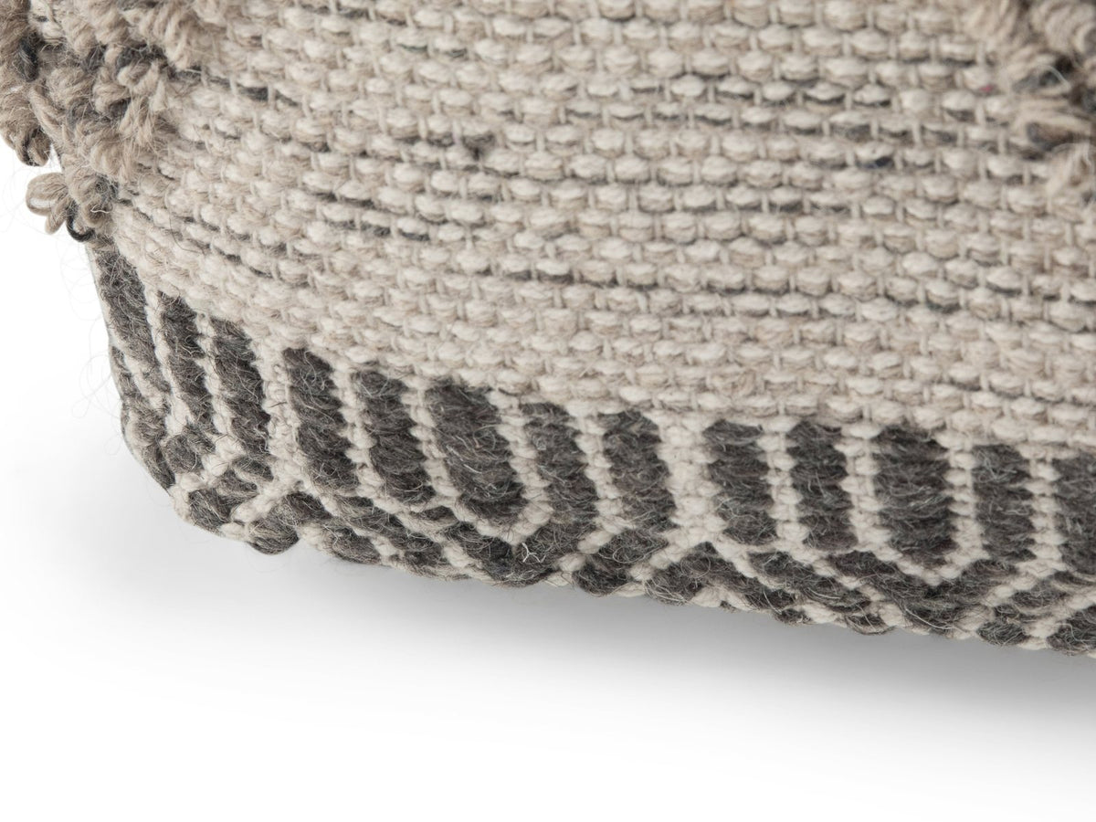 Close-up of the Triora Handloom Wool and Cotton Square Pouf: base