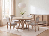 Tropea 54-Inch Round Extending Mindi Veneer Dining Set with 4 Chairs and Server in a bright plaster dining room with linen curtains