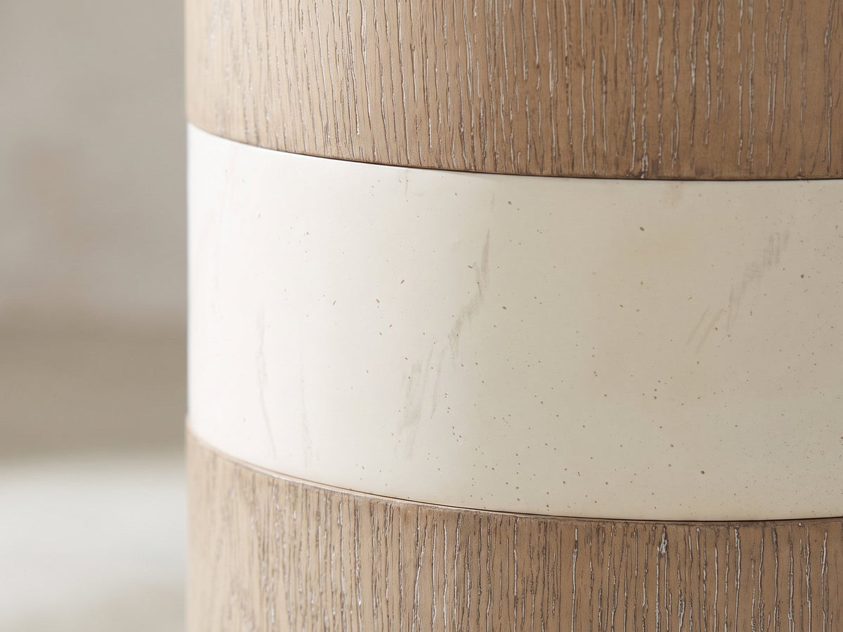 Close-up of the Tuglie Cerused Toffee Drum Side Table: the cream band set into the cerused wood drum