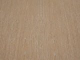 Close-up of the Tuglie Cerused Toffee Drum Side Table: the cerused open grain of the toffee wood