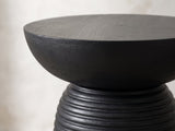Close-up of the Tursi Black Mango Ribbed Pedestal Side Table: the smooth bowl-shaped top above the ribbed base