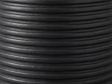 Close-up of the Tursi Black Mango Ribbed Pedestal Side Table: the hand-carved horizontal ribs of the black mango base
